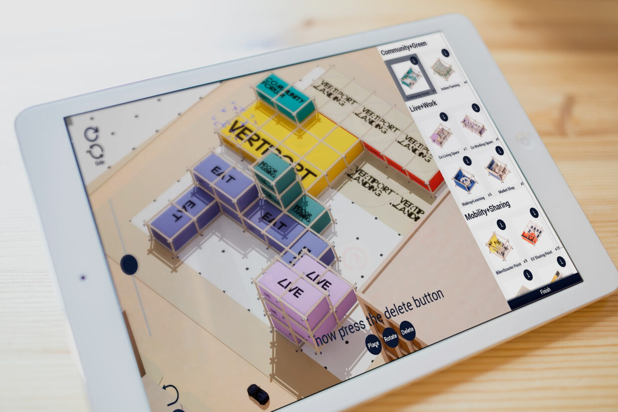 Ipad with Betaport planning tool. Colorful bricks can be arranged by drag and drop.