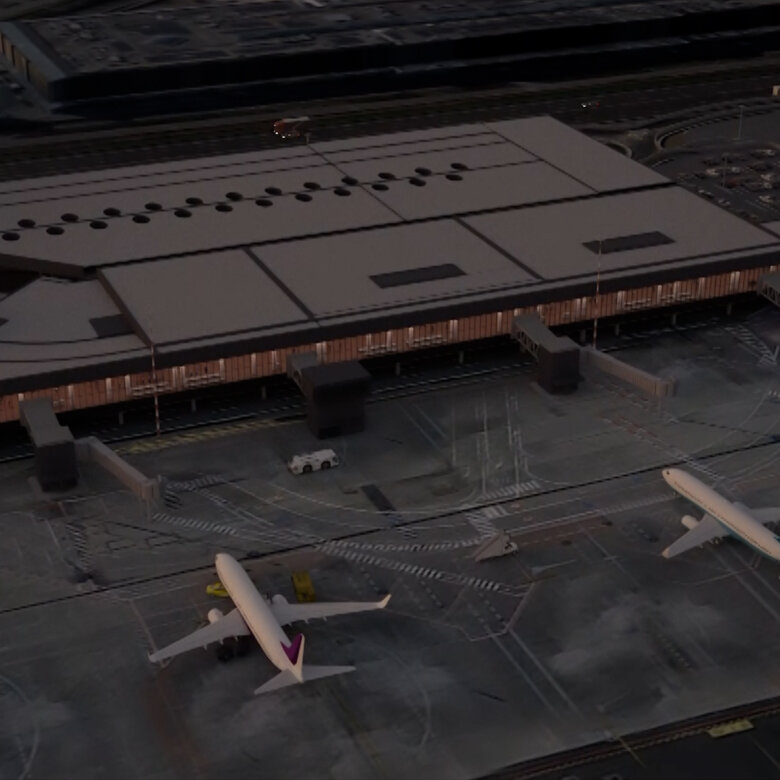 Airplanes in parking position in front of an airport at dawn from bird´s-eye-view.
